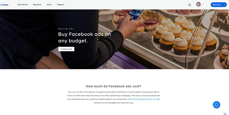 A person hovers their phone near pastries while a webpage titled "Buy Facebook ads on any budget" is displayed. The page includes a navigation bar, a call-to-action button, and information on ad costs.